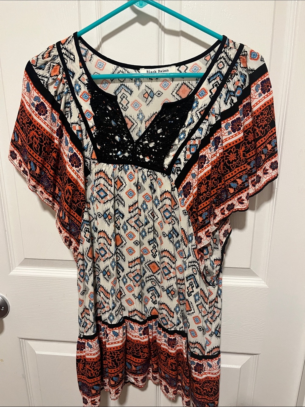 Black Rainn Ivory Tunic with Black Crochet Yoke and Rust-Navy Print